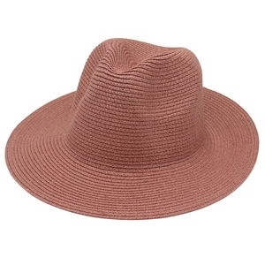 Detailed weave of dusty pink Panama straw hat with a classic Fedora crown design