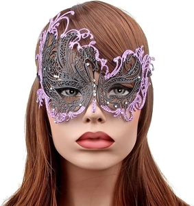 Detail of purple Venetian masquerade mask with glitter and rhinestones on mannequin