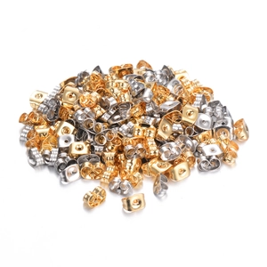 Gold and silver butterfly earring backs in bulk quantity on white background