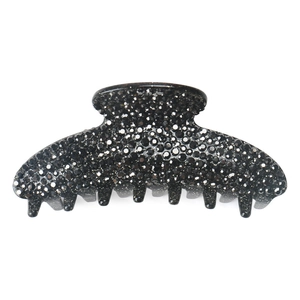 Detailed close-up of large black acrylic claw clip featuring sparkling rhinestones finish