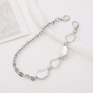 Detailed view of silver metal phone strap chain with oval solid and hollow links