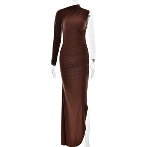 Detail view of dark brown one-shoulder dress featuring side pleats and a high leg slit