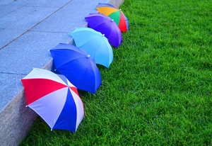 Close-up of colorful decorative umbrella hats on stairs for sun and rain protection