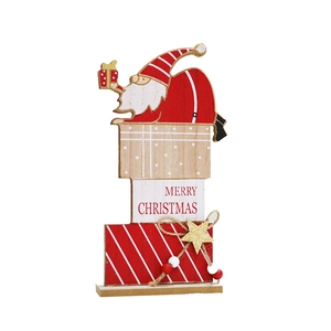 Wooden Christmas Santa decoration with Merry Christmas text on a gift box stand