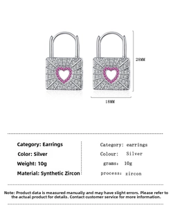 Detailed view of silver heart lock earrings with pink zircon and dimensions of 18x28mm