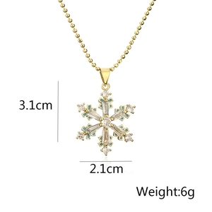 Detailed view of gold snowflake heart pendant with dimensions 3.1cm by 2.1cm and 6g weight