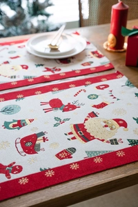 Macro view of woven Jacquard Christmas placemat with Santa Claus and reindeer patterns