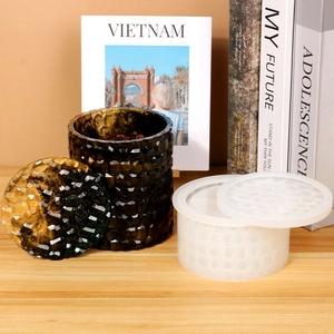 Close-up of translucent silicone mold and finished resin storage jar with faceted texture
