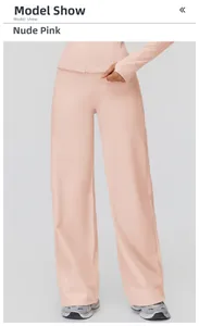 Detail of nude pink high-waist wide-leg yoga pants and matching zip-up sports top
