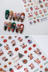 Macro view of 3D embossed Christmas deer nail stickers with Santa and trees