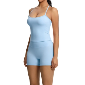 Light blue two-piece yoga set with slim fit halter sports bra and high-waist shorts