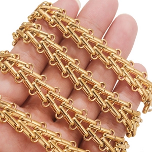 Industrial gold geometric heavy chain necklace featuring multi-layered link design