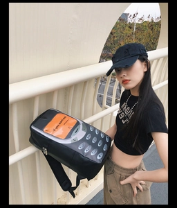 Unique vintage phone style backpack with orange screen and call me quote detail