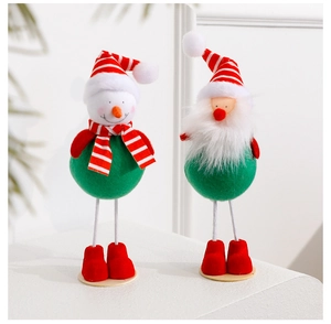 Close-up of festive Christmas figurines featuring Santa and Snowman in knit textures