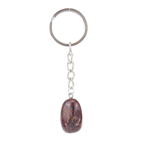 Detailed close-up of dark red natural stone egg pendant on a silver metal keychain