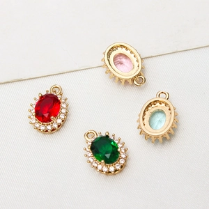 Oval crystal pendants with gold-plated micro-pave zircon edges in four assorted colors