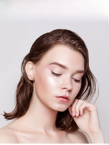 Close-up of 925 sterling silver six-prong moissanite stud earrings on a female model