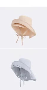 Detail of outdoor sun hat with wide double brim and neck protection flap for women