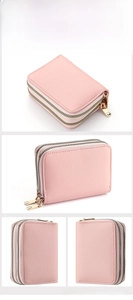 Macro view of light pink lychee grain leather finish and dual golden zippers on card wallet