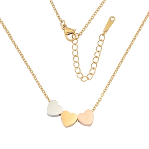 Detailed view of three-tone heart pendants in silver, gold, and rose gold on a cross chain