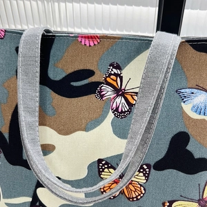 Women's butterfly camouflage canvas tote bag with reinforced grey woven handles