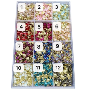 Detailed grid showing twelve vibrant heart-shaped crystal pendants in a clear storage case