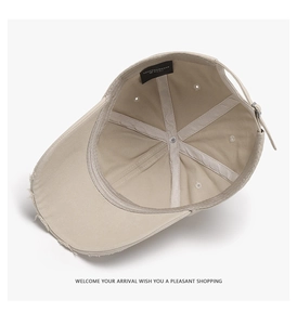 Detail view of cotton baseball cap interior featuring stitching and metal buckle