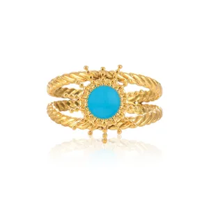 Detail of gold-plated twisted double-band ring with celestial turquoise stone setting