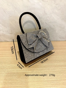 Detail showing dimensions of rhinestone evening bag with elegant crystal bow decoration