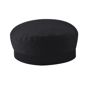 Detail of the high-quality textured fabric and stitching on a black flat-top navy cap