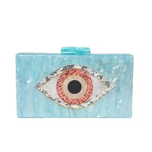 Blue marble acrylic evening clutch bag featuring a sequined evil eye design on the front