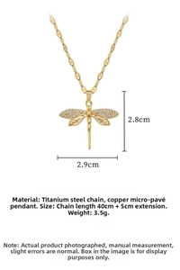Macro shot of dragonfly pendant showing 2.8cm dimensions and titanium steel chain