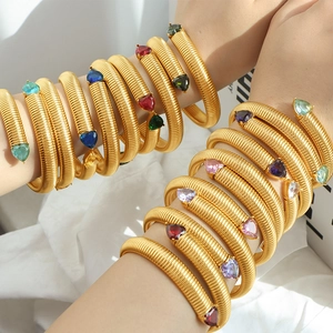 Golden spiral snake bone stretch bracelet with colorful heart and pear shaped gemstones