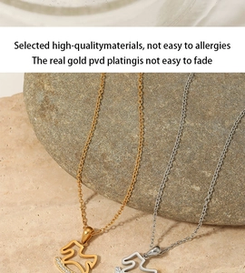 Detailed macro of gold and silver minimalist wave pendants with inlaid white zircons