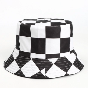 Detailed close-up showing black and white checkerboard pattern on the cotton bucket hat
