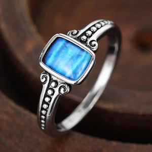 Vintage oxidized silver ring with square blue shell and intricate floral engraving