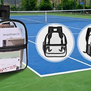 Mini transparent PVC backpack with black straps shown on an outdoor tennis court