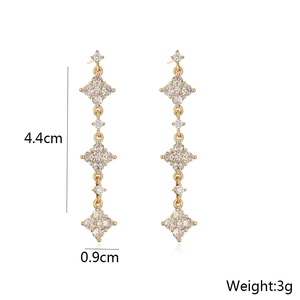 Detail view of 18K gold plated tassel earrings with cubic zirconia and size dimensions