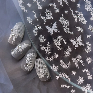 Exquisite white lace floral nail stickers with miniature rhinestone butterfly accents