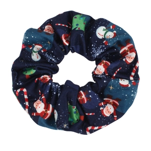 Close-up of navy blue Christmas scrunchie with festive Santa and snowman prints
