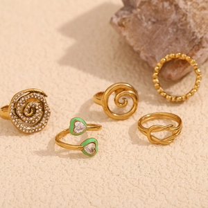 Minimalist 18K gold plated stainless steel ring set featuring spiral and knot designs