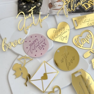 Golden and pink acrylic Valentines Day cupcake toppers with various romantic engravings