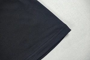 Detail shot of the black hem featuring high-quality double-needle flat stitch finish