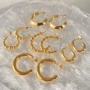 Set of 5 pairs of gold stainless steel hoop earrings in twisted, beaded, and smooth styles