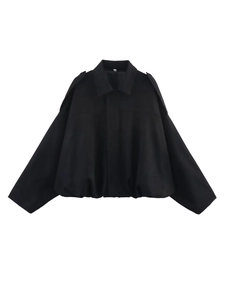 Detail of black suede oversized jacket with cape sleeves and elastic hem detail