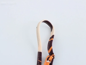 Close-up of adjustable strap on patterned maxi dress with metal ring and bohemian print