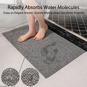 Gray absorbent bathroom mat with non-slip texture and high-density fiber details