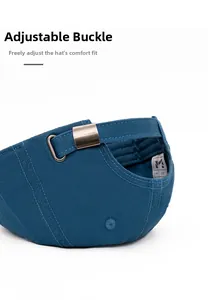 Detail of adjustable metal buckle on dark blue cotton baseball cap with neat stitching