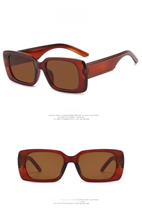 Close-up of rectangular dark tea sunglasses with semi-transparent brown frames