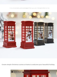 Detail of red and bronze LED Christmas telephone booth ornaments with Santa and snowman scenes